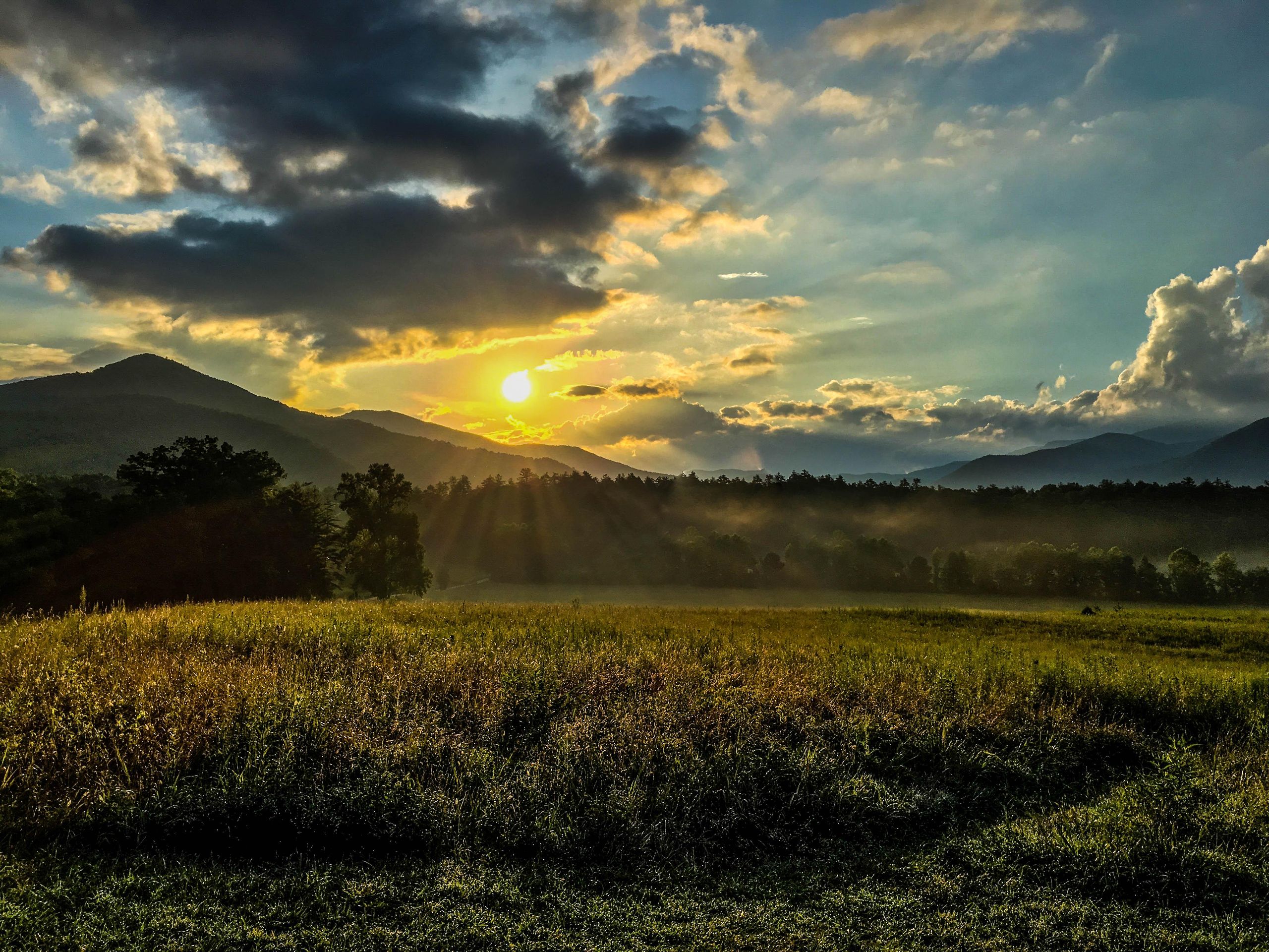 Breathtaking Great Smoky Mountains sunrise Cades Cove Tennessee misty layers dramatic landscape