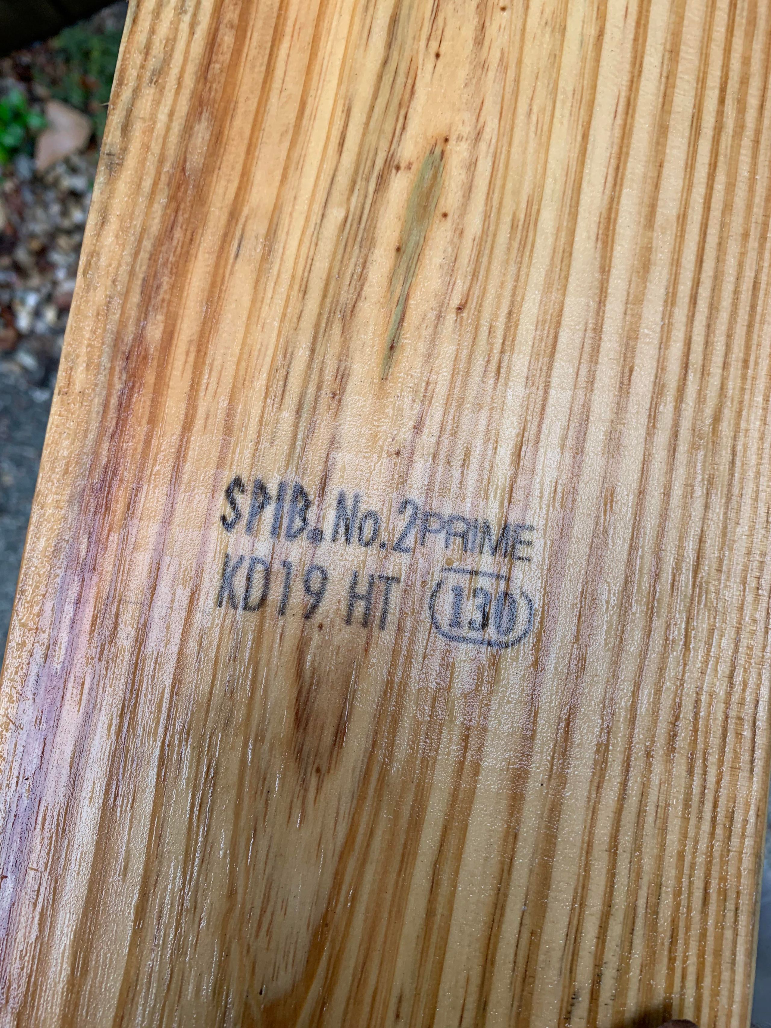 Pressure treated lumber stamp showing treatment rating details