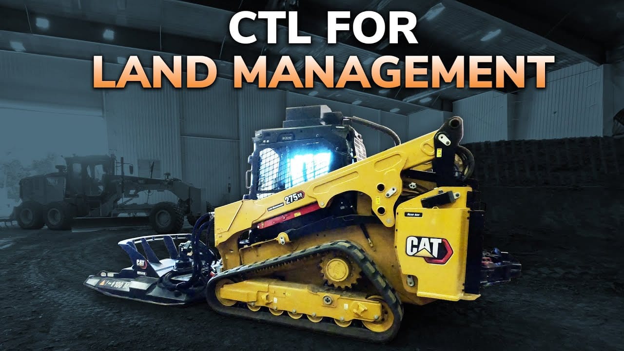CAT 275 XE Compact Track Loader with Mulching Attachment on Residential Property